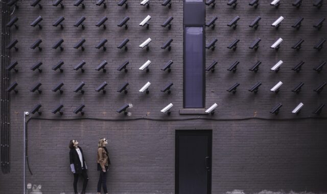 building, cctv, door, female, ladies, pattern, people, security cameras, shape, steel and concrete structure, wall, women, gray building, gray camera, gray wall, gray security, gray door, gray pattern, gray lady, cctv, cctv, cctv, cctv, cctv